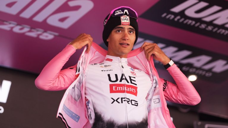 Mexico's Isaac Del Toro Romero of Uae Team Emirates Xrg celebrates with the pink jersey after the 19th stage of the Giro d'Italia cycling race, from Biella to Champoluc, Italy, Friday, May 30, 2025. (Fabio Ferrari/LaPresse via AP)
