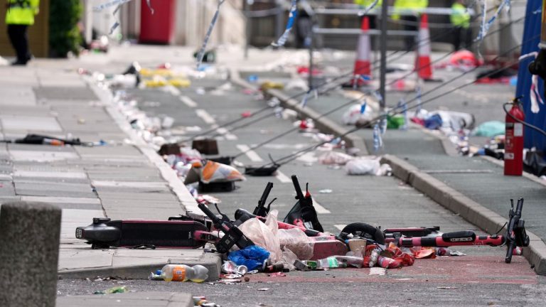 Scooters lie on the site where a 53-year-old British man plowed a minivan into a crowd of Liverpool soccer fans who were celebrating the city's Premier League championship Monday, injuring more than 45 people in Liverpool, England, Tuesday, May 27, 2025.(Jon Super/AP)