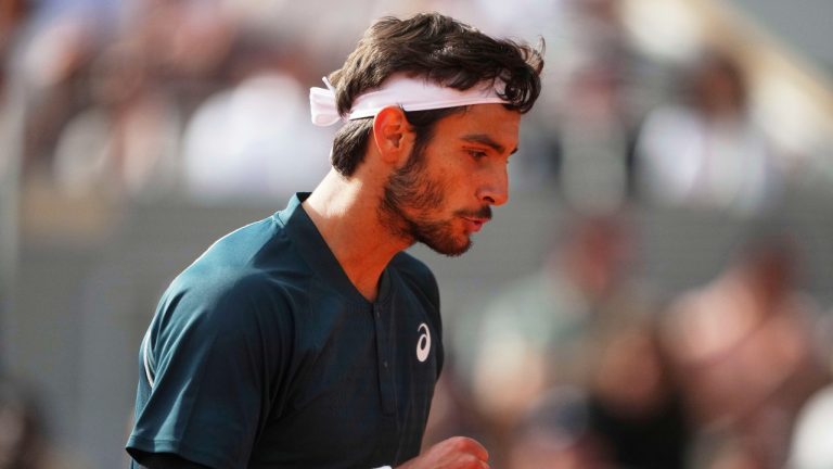 Italy's Lorenzo Musetti reacts as he plays Germany's Yannick Hanfmann, after their first round match of the French Tennis Open at the Roland Garros stadium, in Paris, Sunday May 25, 2025. (Lindsey Wasson/AP)