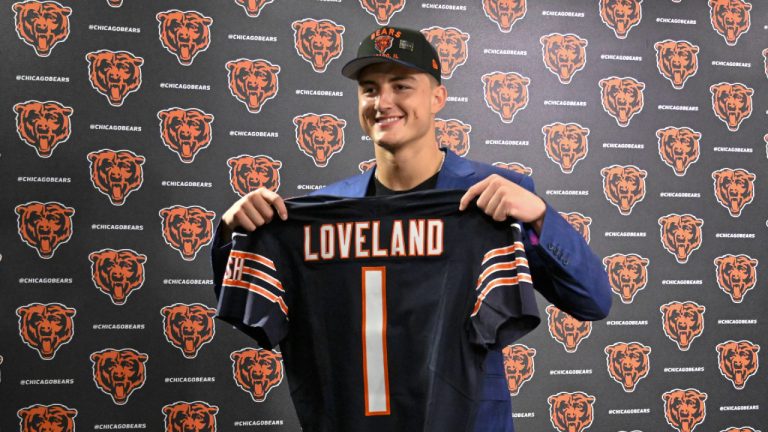 Tight end Colston Loveland, the Chicago Bears' first round draft pick, 10th overall, shows off his jersey during an NFL football press conference, Friday, April 25, 2025, in Lake Forest, Ill. (Matt Marton/AP)