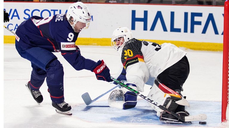 USA's Jackson Blake, left, scores on Germany's Nikita Quapp during second period IIHF World Junior Hockey Championship hockey action in Moncton, N.B., Monday, Jan. 2, 2023. (Ron Ward/Canadian Press)