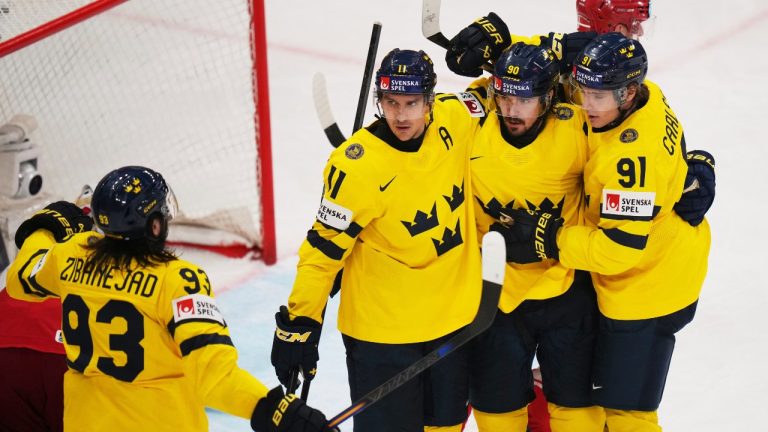 Swedish players celebrate after a goal during the bronze medal match between Denmark and Sweden at the ice hockey world championships in Stockholm, Sweden, Sunday, May 25, 2025. (Petr David Josek/AP)