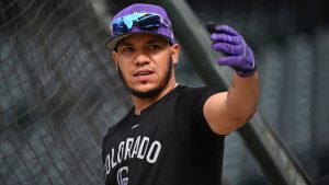 Colorado Rockies' Thairo Estrada swings his arm prior to a baseball game against the Philadelphia Phillies, Wednesday, May 21, 2025, in Denver. (Geneva Heffernan/AP)