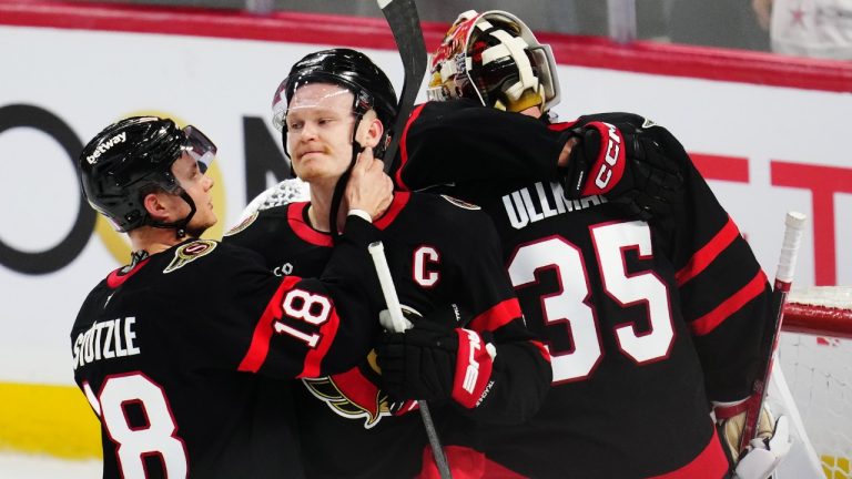 Ottawa Senators' Tim Stutzle (18), Brady Tkachuk (7) and goaltender Linus Ullmark (35) react following their loss to the Toronto Maple Leafs in NHL playoff hockey action in Ottawa on Thursday, May 1, 2025. (Sean Kilpatrick/CP)