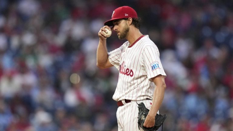 Philadelphia Phillies pitcher Aaron Nola wipes his face during the fourth inning in the second baseball game of a doubleheader against the St. Louis Cardinals Wednesday, May 14, 2025, in Philadelphia. (AP/Matt Slocum)