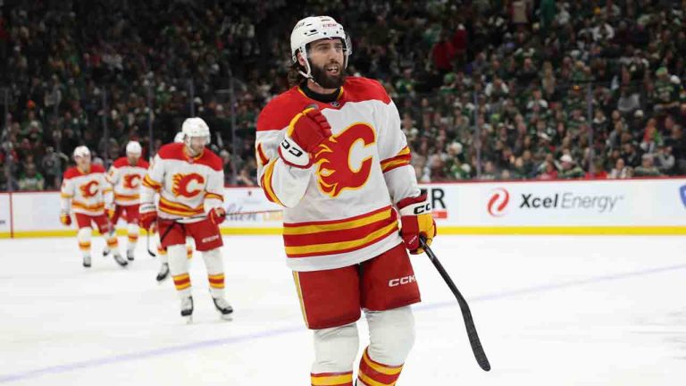 Calgary Flames center Clark Bishop, foreground, celebrates after scoring during the third period of an NHL hockey game against the Minnesota Wild, Saturday, Jan. 25, 2025, in St. Paul, Minn. (Ellen Schmidt/AP)