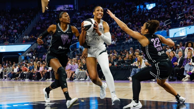 Golden State Valkyries center Temi Fagbenle and guard Veronica Burton defend against Las Vegas Aces center A'ja Wilson in the first half of a WNBA game, Saturday, June 7, 2025. (Yalonda M. James/San Francisco Chronicle via AP)