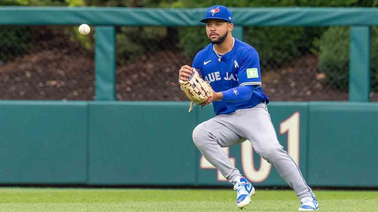 Toronto Blue Jays' Jonatan Clase runs down a single hut by Philadelphia Phillies' Weston Wilson during the eighth inning of a baseball game, Sunday, June 15, 2025, in Philadelphia. (Laurence Kesterson/AP)