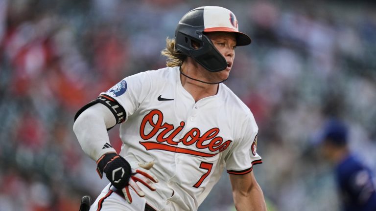 Baltimore Orioles' Jackson Holliday advances toward first base after hitting an RBI double to score Chadwick Tromp during the third inning of a baseball game against the Texas Rangers, Monday, June 23, 2025, in Baltimore. (AP Photo/Stephanie Scarbrough)