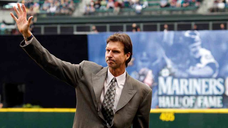 Formers Seattle Mariners' Randy Johnson waves to fans following an induction ceremony for himself and Dan Wilson into the Mariners Hall of Fame before a baseball game between the Mariners and the Kansas City Royals, Saturday, July 28, 2012, in Seattle. (Elaine Thompson/AP)