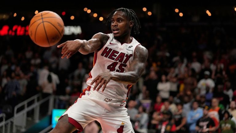 Miami Heat guard Davion Mitchell (45) passes the ball in overtime of an NBA play-in tournament basketball game against the Atlanta Hawks, Friday, April 18, 2025, in Atlanta. (Brynn Anderson/AP)