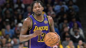 Los Angeles Lakers forward Dorian Finney-Smith (17) handles the ball in the second half of an NBA basketball game against the Memphis Grizzlies Saturday, March 29, 2025, in Memphis, Tenn. (AP Photo/Brandon Dill)