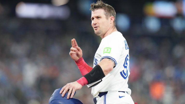 Toronto Blue Jays' Tyler Heineman gestures towards the Philadelphia Phillies dug out after hitting a two run RBI single off Phillies pitcher Jesus Luzardo (44) during third inning MLB baseball action in Toronto, Thursday, June 5, 2025. (Chris Young/CP)