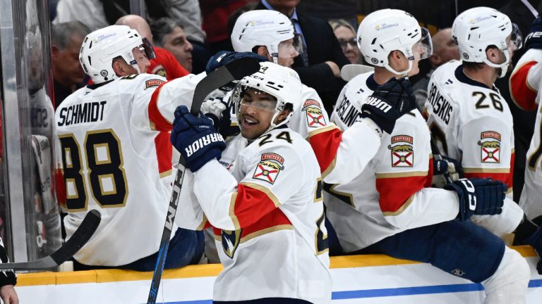 Florida Panthers right wing Justin Sourdif (24) is congratulated by defenceman Nate Schmidt (88) after scoring against the Nashville Predators during the second period of an NHL hockey game, Tuesday, Feb. 25, 2025, in Nashville, Tenn. (John Amis/AP)