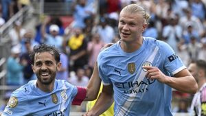 Manchester City's Erling Haaland celebrates with teammate Bernardo Silva after scoring his side's third goal during the Club World Cup Group G match between Juventus and Manchester City in Orlando, Fla., Thursday, June 26, 2025. (AP/Phelan Ebenhack)