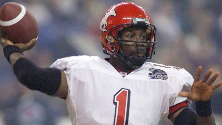 Calgary Stampeders quarterback Marcus Crandell fires a pass against the Winnipeg Blue Bombers during first half action at the 89th Grey Cup at the Olympic Stadium Sunday, Nov. 25, 2001 in Montreal. Crandell signed a one-day contract with the Stampeders at age 51 so he could officially retire as a member of the club. (Andre Forget/CP)