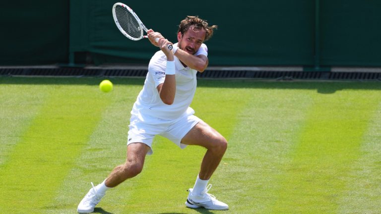 Daniil Medvedev of Russia returns the ball to Benjamin Bonzi of France during their first round men's single match at the Wimbledon Tennis Championships in London, Monday, June 30, 2025. (Kirsty Wigglesworth/AP)