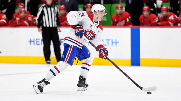 Montreal Canadiens defenseman Lane Hutson looks to pass during the first period of an NHL hockey game against the Detroit Red Wings, Thursday, Jan. 23, 2025, in Detroit. (Jose Juarez/AP)