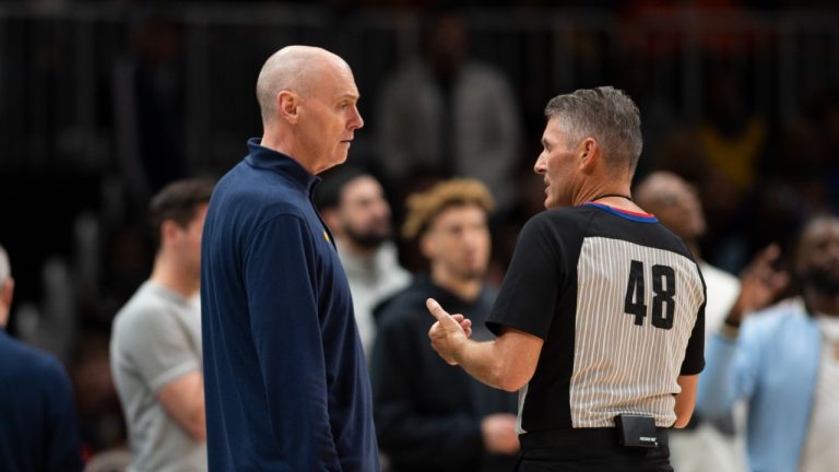 Referee Scott Foster (48) speaks with Indiana Pacers head coach Rick Carlisle during the second half of an NBA basketball game against the Atlanta Hawks, Sunday, March 13, 2022, in Atlanta. (AP Photo/Hakim Wright Sr.)