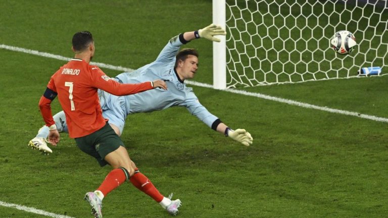 Portugal's Cristiano Ronaldo scores his side's second goal during the Nations League semifinal match between Portugal and Germany in Munich, Germany, Wednesday, June 4, 2025. (Peter Kneffel/dpa via AP)