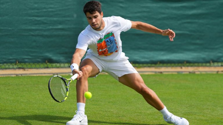 Carlos Alcaraz of Spain plays a return during a practice session at the All England Lawn Tennis and Croquet Club, ahead of the Wimbledon Championships in London, Wednesday, June 25, 2025. (Kirsty Wigglesworth/AP)
