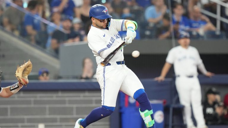 Toronto Blue Jays shortstop Bo Bichette hits the go-ahead RBI single off Chicago White Sox pitcher Adrian Houser during seventh inning MLB baseball action in Toronto on Sunday June 22, 2025. (Chris Young/CP)