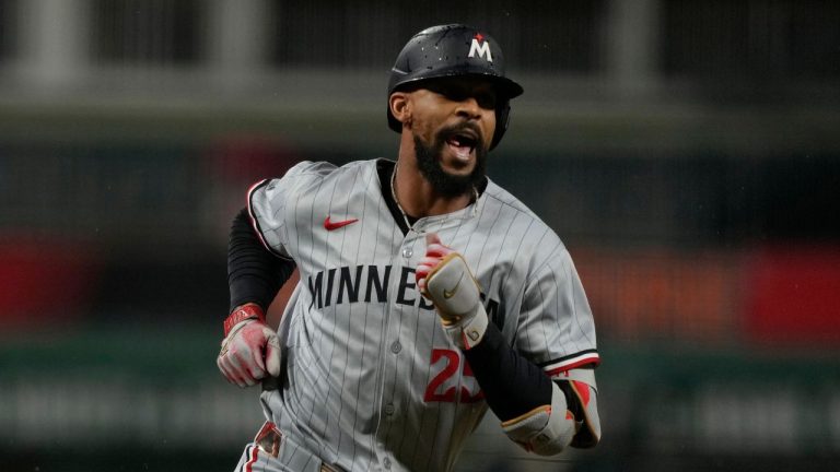Minnesota Twins' Byron Buxton celebrates hitting a solo home run as he rounds the bases in the first inning of a baseball game against the Cincinnati Reds, Wednesday, June 18, 2025, in Cincinnati. (Carolyn Kaster/AP)