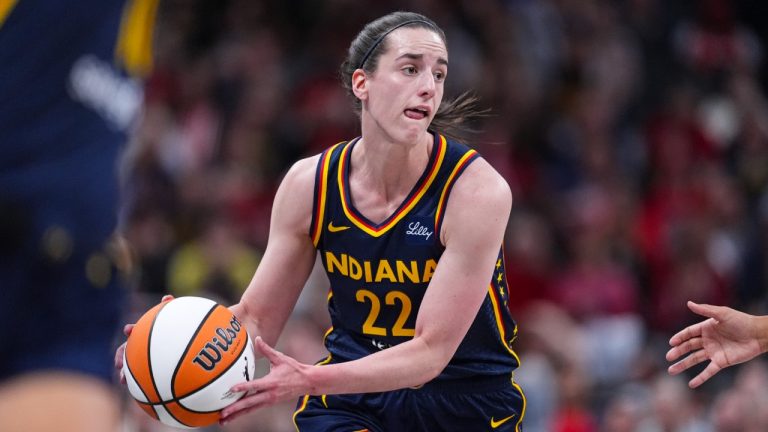 Indiana Fever guard Caitlin Clark (22) plays against the Atlanta Dream in the first half of a WNBA basketball game in Indianapolis, Tuesday, May 20, 2025. (Michael Conroy/AP)