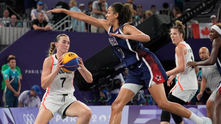 Canada's Paige Crozon (7) looks to pass under pressure from United States' Cierra Burdick, right, during a women's 3x3 basketball bronze medal game at the 2024 Summer Olympics, Monday, Aug. 5, 2024, in Paris, France. (Frank Franklin II/AP)