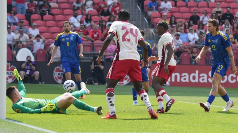 Canada's Jonathan David slots past Ukraine's goalkeeper Anatolii Trubin for his country's opening goal during first half action in the Canadian Shield Tournament, in Toronto, Saturday, June 7, 2025. (Chris Young/THE CANADIAN PRESS)