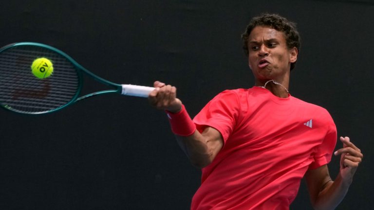 Gabriel Diallo of Canada plays a forehand return to Karen Khachanov of Russia during their second round match at the Australian Open tennis championship in Melbourne, Australia, Thursday, Jan. 16, 2025. (Manish Swarup/AP)