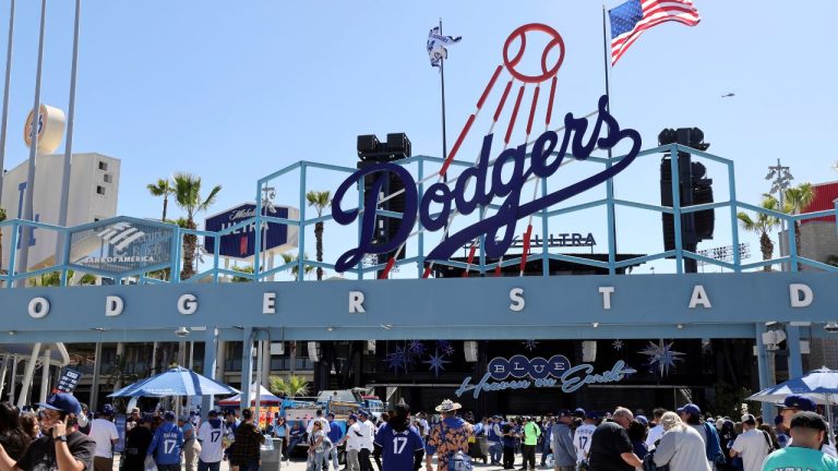 Fans arrive at Dodger Stadium to receive a bobblehead doll of Los Angeles Dodgers' Shohei Ohtani before a baseball game against the Atlanta Braves Wednesday, April 2, 2025, in Los Angeles. (Kevork Djansezian/AP)