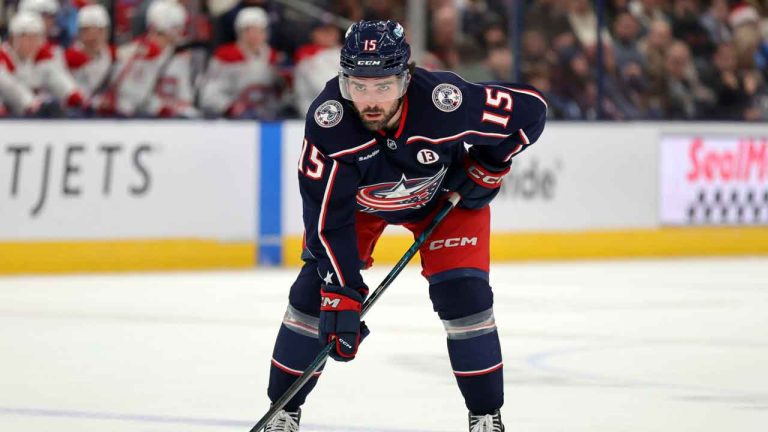 Columbus Blue Jackets defenseman Dante Fabbro waits on the puck drop against the Montreal Canadiens during an NHL hockey game. (Paul Vernon/AP)