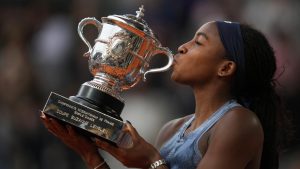 United States' Coco Gauff holds the tropy after winning the final match of the French Tennis Open at the Roland-Garros against Aryna Sabalenka of Belarus in Paris, Saturday, June 7, 2025. (Thibault Camus/AP)