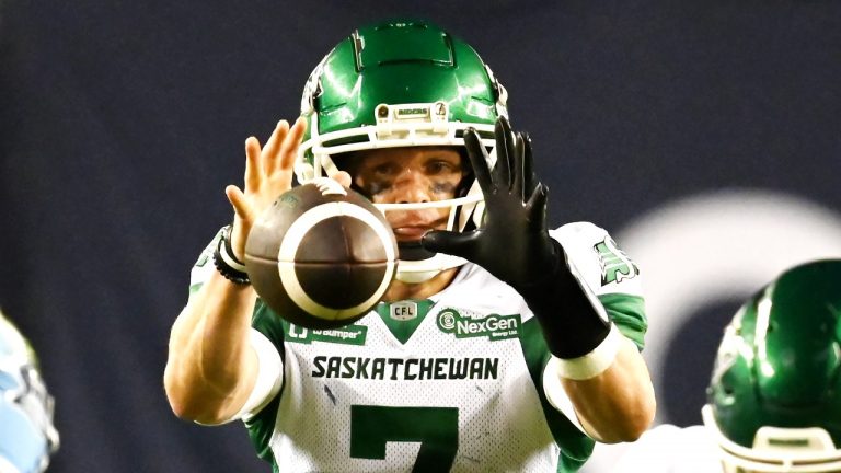 Saskatchewan Roughriders quarterback Trevor Harris (7) takes the snap during second half CFL football action against the Toronto Argonauts in Toronto Friday, June 20, 2025. (Jon Blacker/THE CANADIAN PRESS)