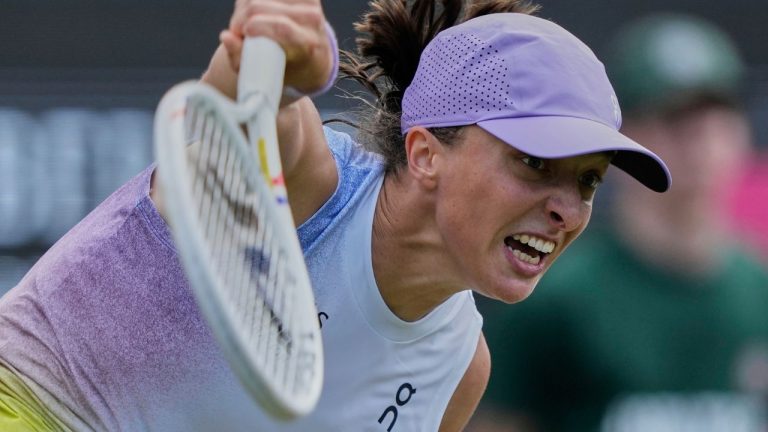 Poland's Iga Swiatek serves against Italy's Jasmine Paolini in their semifinal match at the WTA tennis tournament in Bad Homburg, Germany, Friday, June 27, 2025. (Michael Probst/AP)