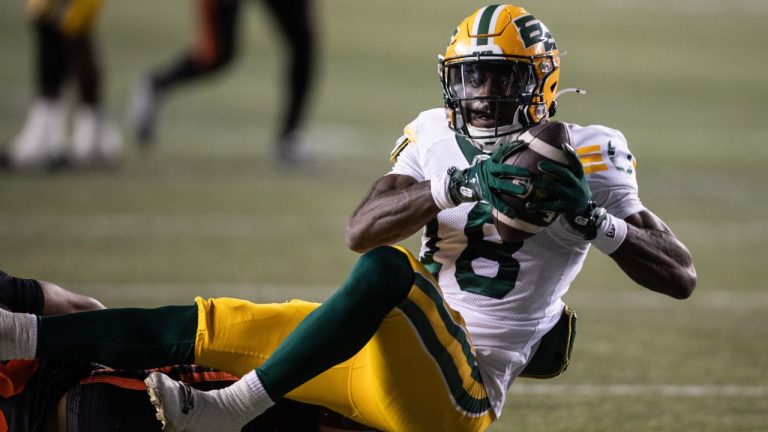 Edmonton Elks' Jalon Calhoun (18) scores a touchdown against the B.C. Lions during second half CFL pre-season action in Edmonton, on Friday May 30, 2025. (Jason Franson/CP)