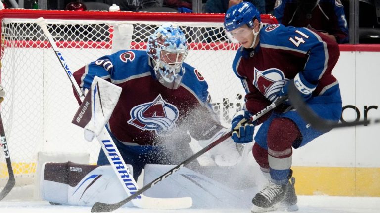 Vegas Golden Knights right wing Sheldon Rempal, left, has his shot blocked by Colorado Avalanche goalie Justus Annunen, centre, as Avalanche centre Jason Polin, right, clears the puck in the third period of a pre-season NHL hockey game Monday, Sept. 25, 2023, in Denver. (David Zalubowski/AP)