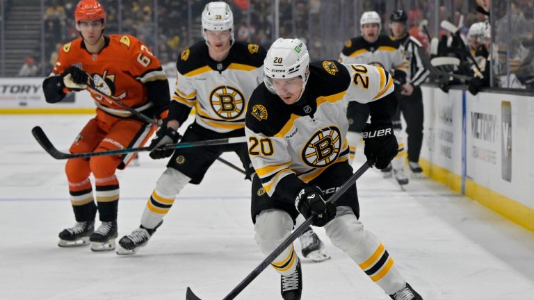 Boston Bruins defenseman Henri Jokiharju, front, skates the puck down ice during the first period of an NHL hockey game against the Anaheim Ducks, Wednesday, March 26, 2025, in Anaheim, Calif. (Jayne-Kamin-Oncea/AP Photo)