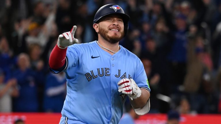 Toronto Blue Jays' Alejandro Kirk (30) runs to first base after hitting a walk-off RBI single in tenth inning American League baseball action to defeat the Boston Red Sox in Toronto. (Jon Blacker/CP)