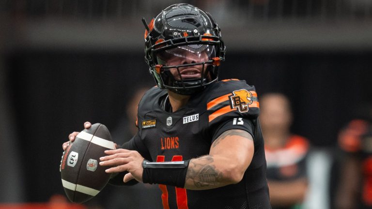 B.C. Lions quarterback Jeremiah Masoli (11) prepares to pass the ball against the Winnipeg Blue Bombers during the first half of a CFL football game in Vancouver, on Saturday, June 21, 2025. (Ethan Cairns/THE CANADIAN PRESS)