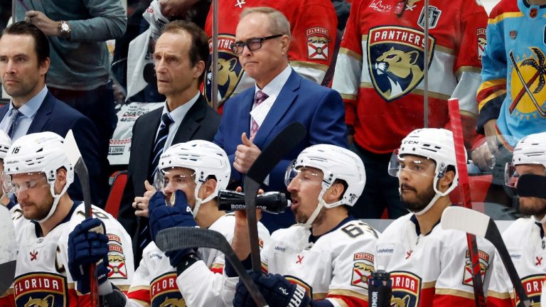 Florida Panthers head coach Paul Maurice, back center, waits for the results of his coaches challenge during the second period of Game 2 of the NHL hockey Stanley Cup Eastern Conference finals against the Carolina Hurricanes in Raleigh, N.C., Thursday, May 22, 2025. (Karl DeBlaker/AP)
