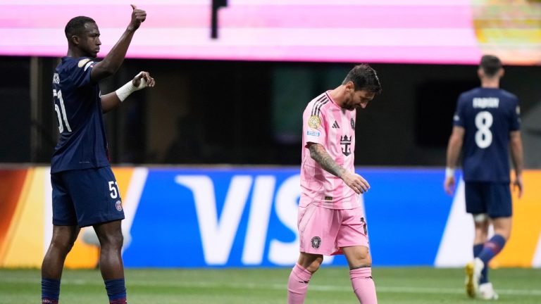 Paris Saint-Germain's Willian Pacho, left, signals as Inter Miami's Lionel Messi, center, walks away during the Club World Cup round of 16 soccer match between PSG and Inter Miami in Atlanta, Sunday, June 29, 2025. (Brynn Anderson/AP)