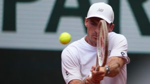 Tommy Paul of the U.S. returns the ball to Australia's Alexei Popyrin during their fourth round match of the French Tennis Open, at the Roland-Garros stadium, in Paris, Sunday, June 1 2025. (Lindsey Wasson/AP)
