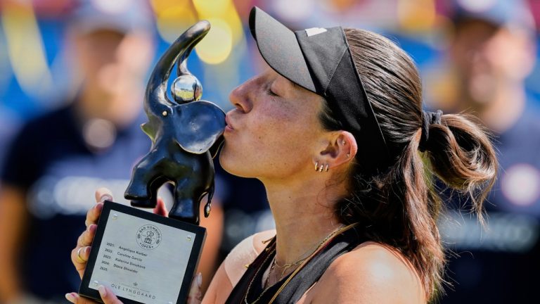 US Jessica Pegula kisses the trophy as she won the final match at the WTA tennis tournament against Poland's Iga Swiatek in Bad Homburg, Germany, Saturday, June 28, 2025. (Michael Probst/AP)