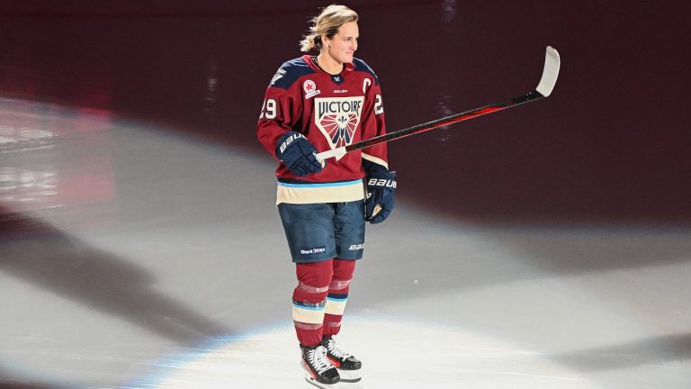 Montreal Victoire's Marie-Philip Poulin salutes the crowd as she's introduced ahead of their PWHL hockey game against the Ottawa Charge in Laval, Que., Saturday, November 30, 2024. (Graham Hughes/CP)