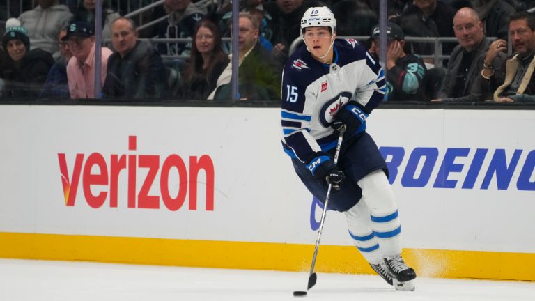 Winnipeg Jets centre Rasmus Kupari moves the puck against the Seattle Kraken during the third period of an NHL hockey game Thursday, Oct. 24, 2024, in Seattle. (Lindsey Wasson/AP)