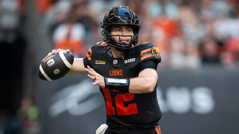 B.C. Lions quarterback Nathan Rourke prepares to throw the ball against the Edmonton Elks during the first half of a CFL football game in Vancouver, on Saturday, June 7, 2025. (Ethan Cairns/THE CANADIAN PRESS)