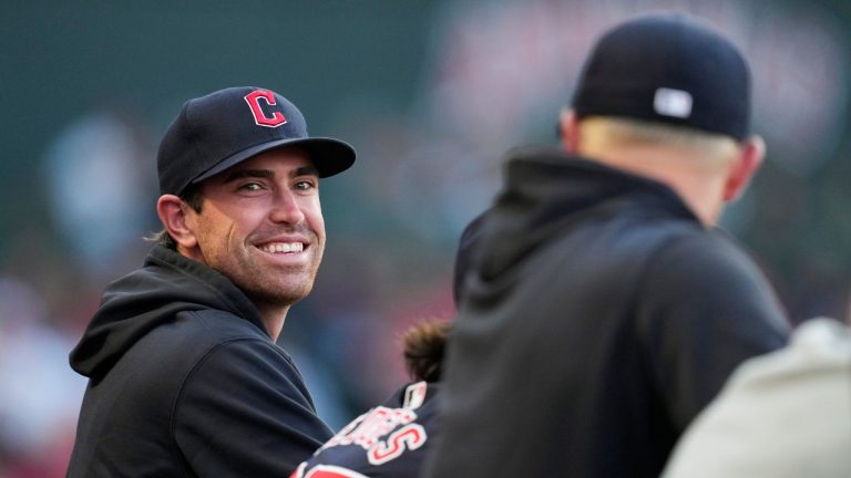 Cleveland Guardians' Shane Bieber stands in the dugout during the third inning of a baseball game against the Los Angeles Angels in Anaheim, Calif., Saturday, May 25, 2024. (Ashley Landis/AP)