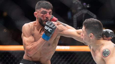 Amir-Albazi-takes-a-punch-during-a-UFC-flyweight-bout